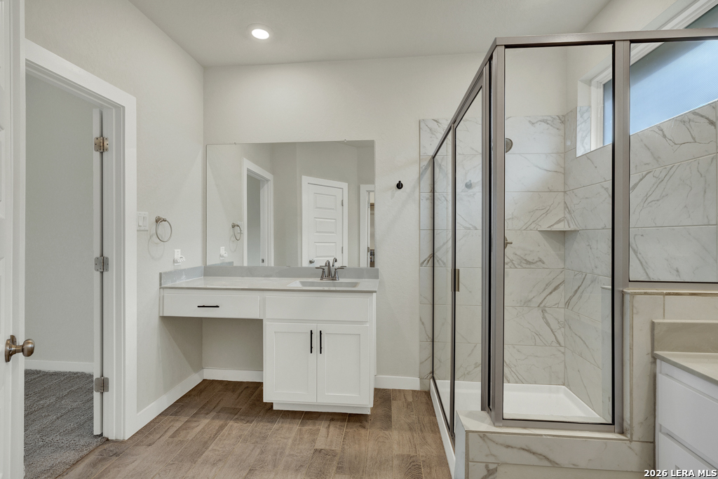 1433 Escarpment Road New Braunfels, TX 78132 - Photo 21 of 37 a bathroom with a shower and a mirror