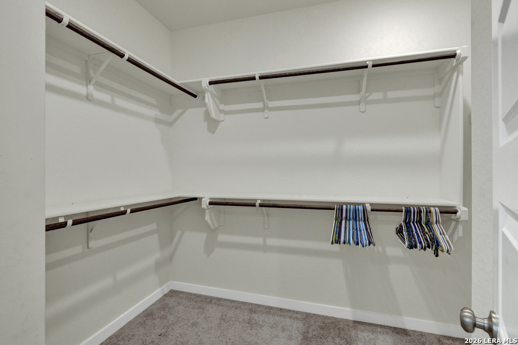 1433 Escarpment Road New Braunfels, TX 78132 - Photo 22 of 37 a view of walk in closet with clothes