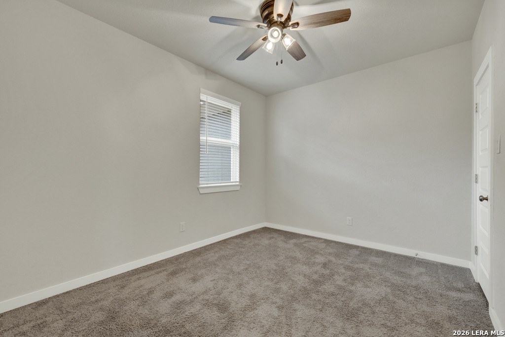 1433 Escarpment Road New Braunfels, TX 78132 - Photo 24 of 37 an empty room with a window
