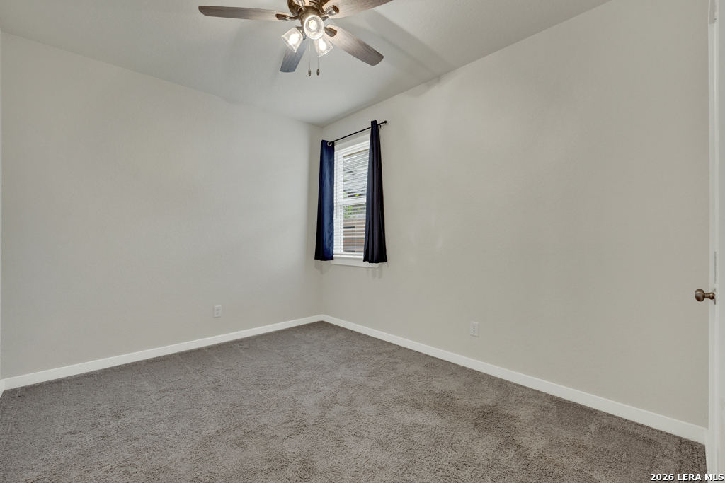 1433 Escarpment Road New Braunfels, TX 78132 - Photo 25 of 37 an empty room with a chandelier fan
