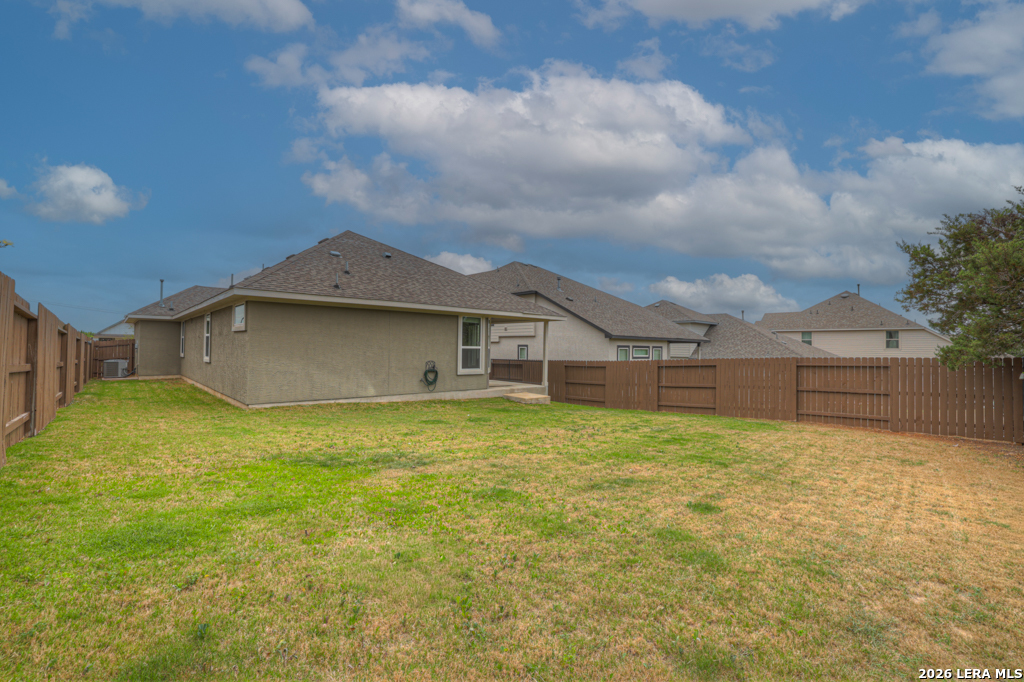 1433 Escarpment Road New Braunfels, TX 78132 - Photo 30 of 37 a view of a big house with a big yard and large tree