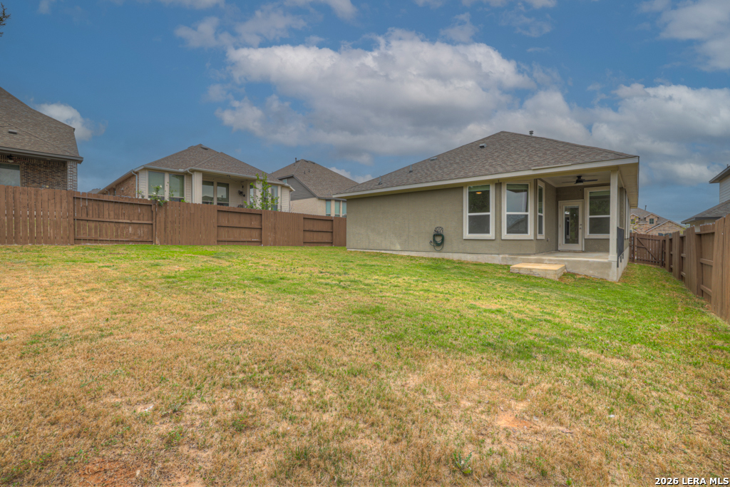 1433 Escarpment Road New Braunfels, TX 78132 - Photo 31 of 37 a view of a house with a yard and sitting area