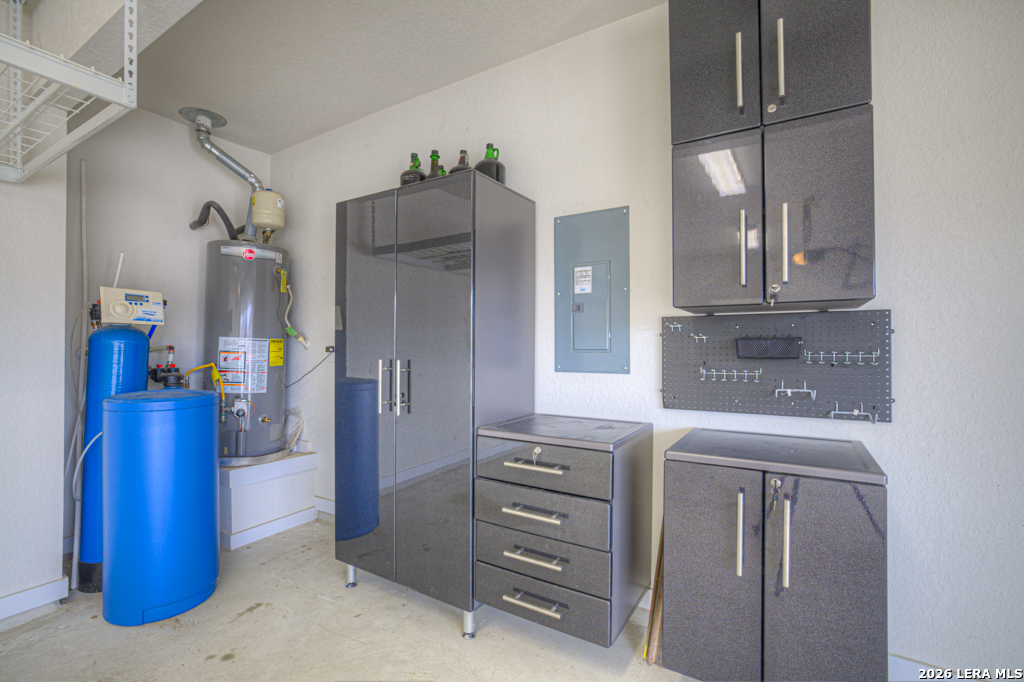 1433 Escarpment Road New Braunfels, TX 78132 - Photo 33 of 37 a kitchen with a refrigerator and cabinets