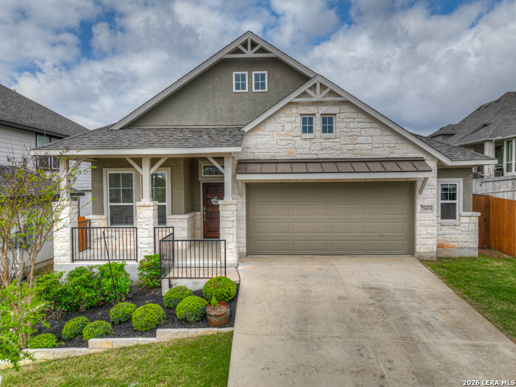 1433 Escarpment Road New Braunfels, TX 78132 - Photo 34 of 37 a front view of a house with a yard and garage