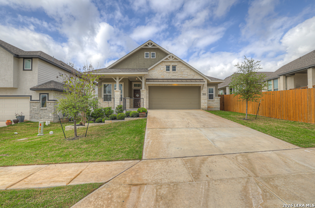 1433 Escarpment Road New Braunfels, TX 78132 - Photo 36 of 37 a front view of a house with a yard and garage