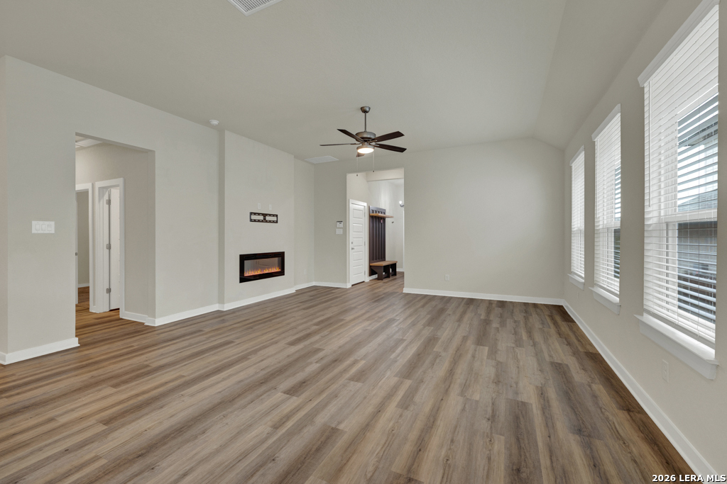 1433 Escarpment Road New Braunfels, TX 78132 - Photo 7 of 37 wooden floor in an empty room with a window