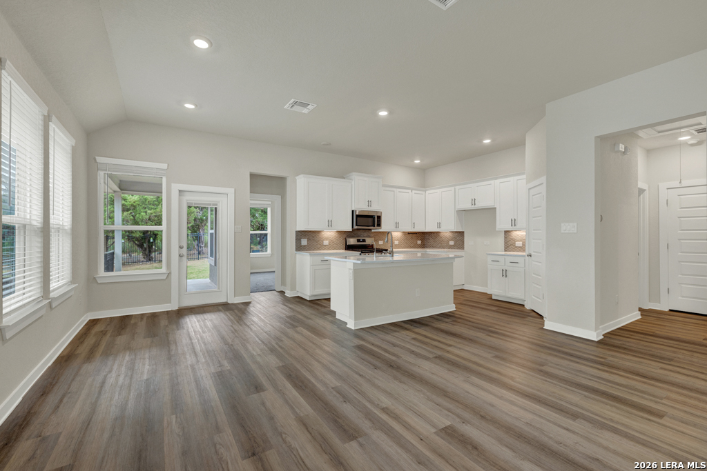 1433 Escarpment Road New Braunfels, TX 78132 - Photo 10 of 37 a view of kitchen with wooden floor