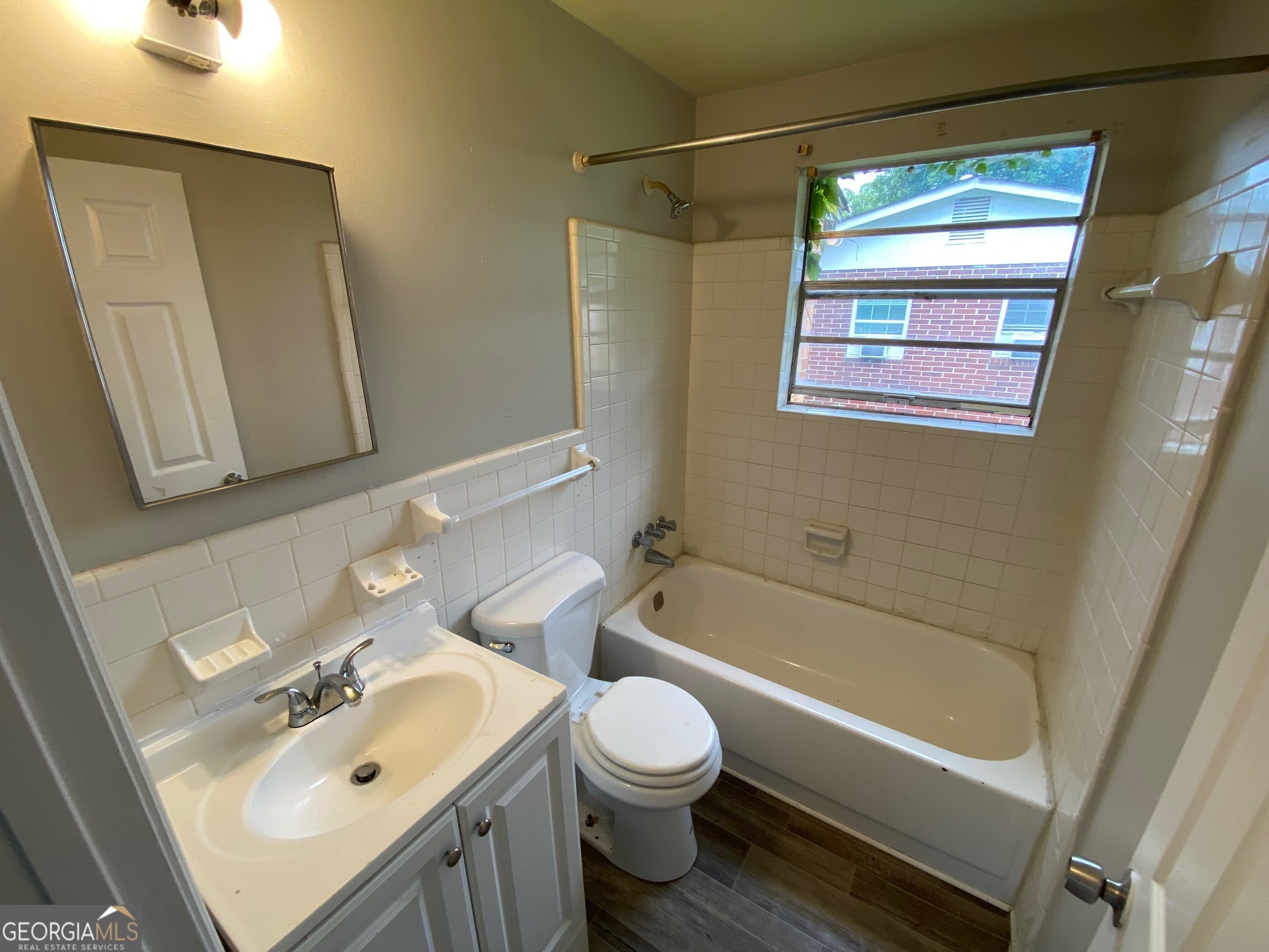 912 Thomas Street Macon, GA 31206 - Photo 8 of 23 a bathroom with a sink a toilet and shower