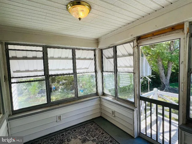 a view of a room and window