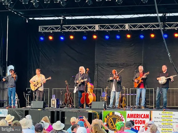 an outdoor space with swimming pool and furniture