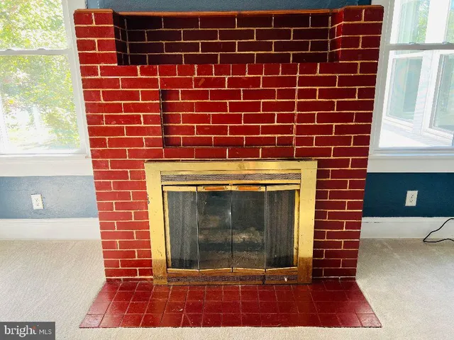 a view of a fireplace with a large window