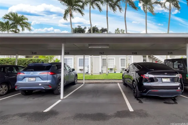 a view of a car parked in back of a garage
