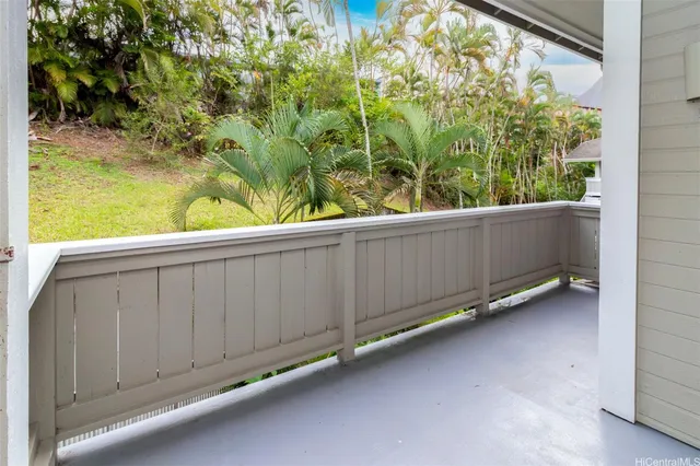 a view of a back yard from a balcony