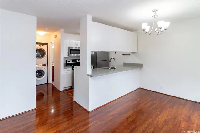 a kitchen with a refrigerator and a sink
