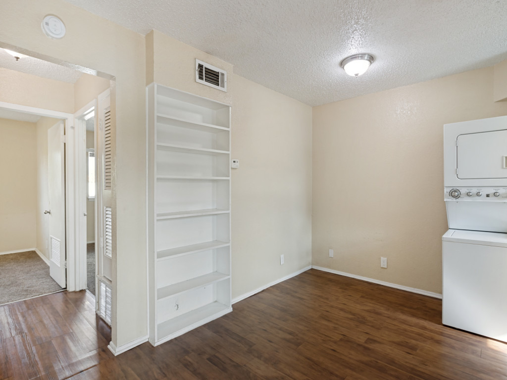 2401 Manor Road, Unit 218 Austin, TX 78722 - Photo 20 of 27 Functional living space with built-in shelving and convenient laundry facilities.
