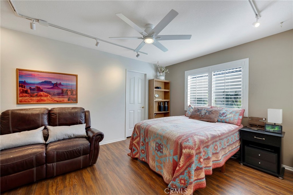 40370 Vía Francisco Murrieta, CA 92562 - Photo 15 of 52 a bedroom with a bed and a couch
