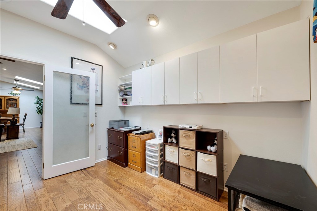 40370 Vía Francisco Murrieta, CA 92562 - Photo 18 of 52 a kitchen with stainless steel appliances wooden floor and a refrigerator