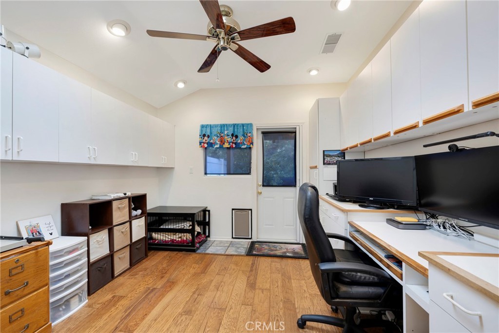 40370 Vía Francisco Murrieta, CA 92562 - Photo 19 of 52 a view of a workspace with furniture and wooden floor