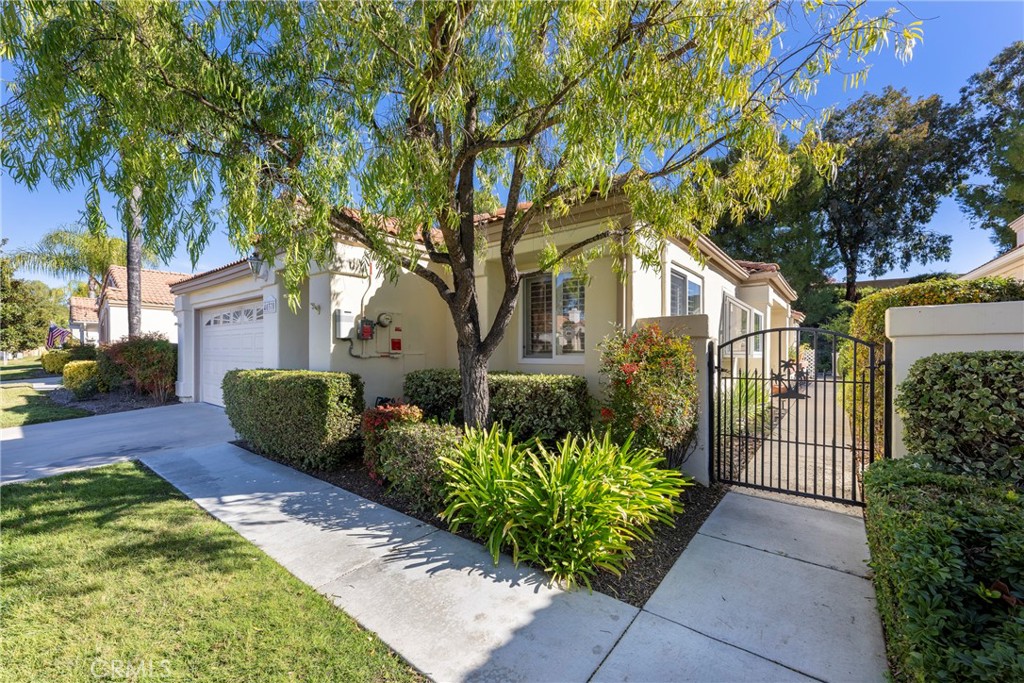 40370 Vía Francisco Murrieta, CA 92562 - Photo 48 of 52 a front view of a house with a garden