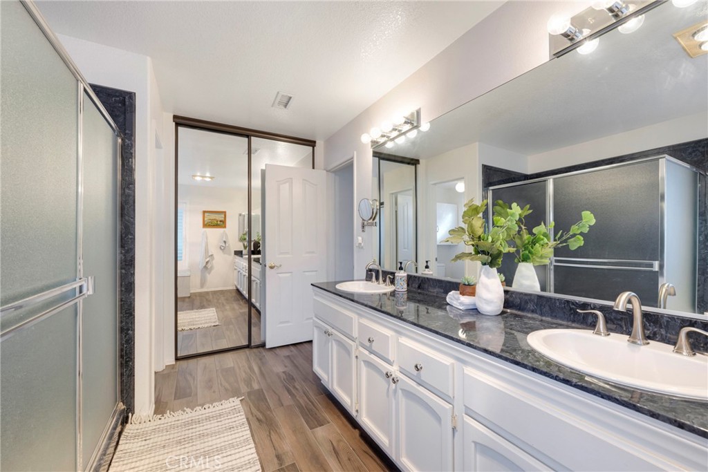 40370 Vía Francisco Murrieta, CA 92562 - Photo 6 of 52 a spacious bathroom with a granite countertop sink mirror and shower