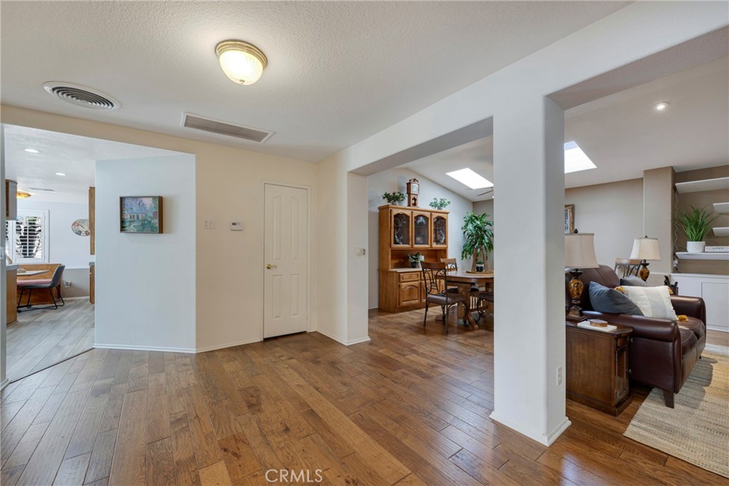 40370 Vía Francisco Murrieta, CA 92562 - Photo 10 of 52 a view of a living room kitchen and a wooden floor