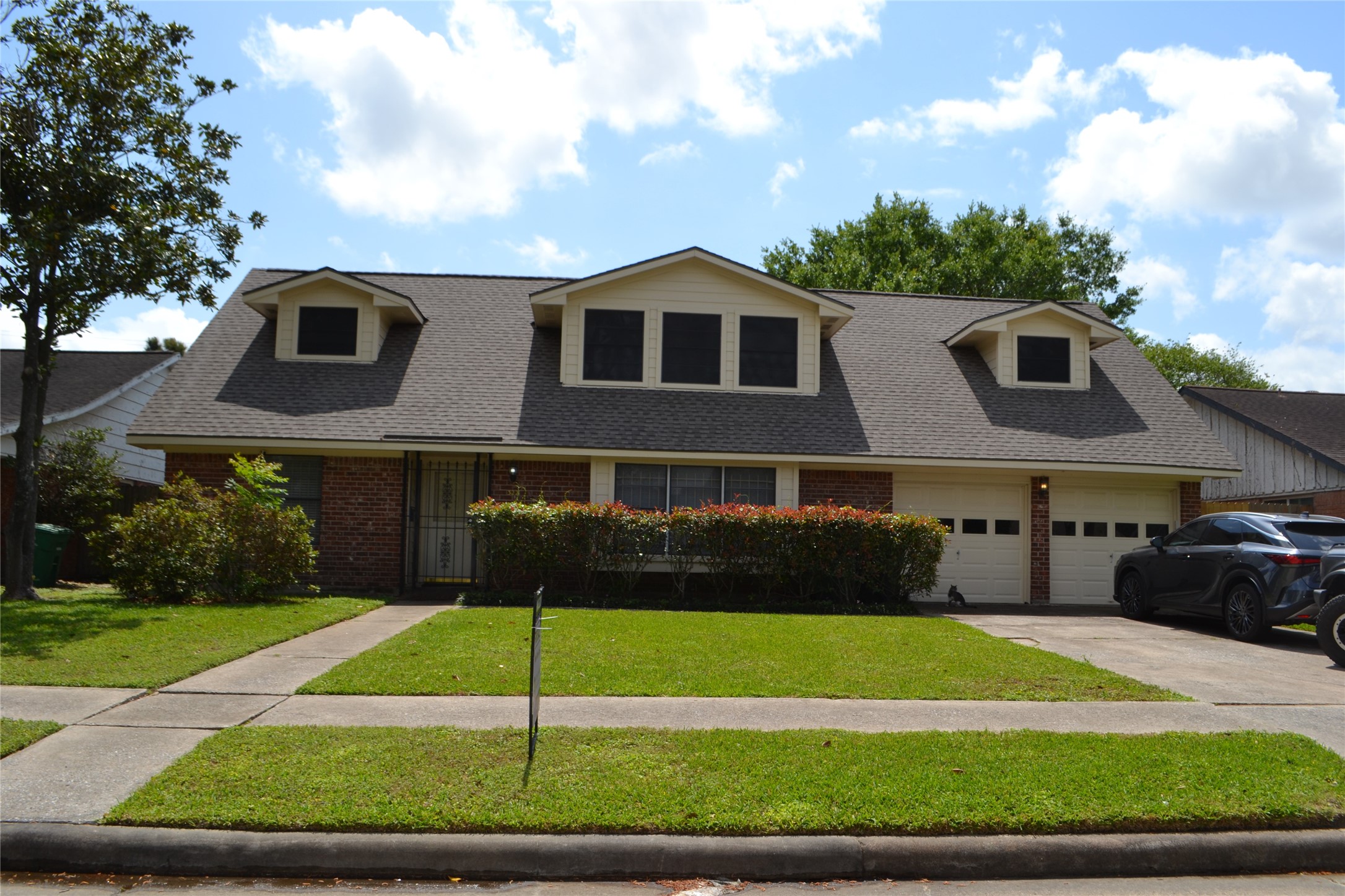 322 Ravenhead Drive Houston, TX 77034 - Photo 1 of 16 a front view of a house with a yard