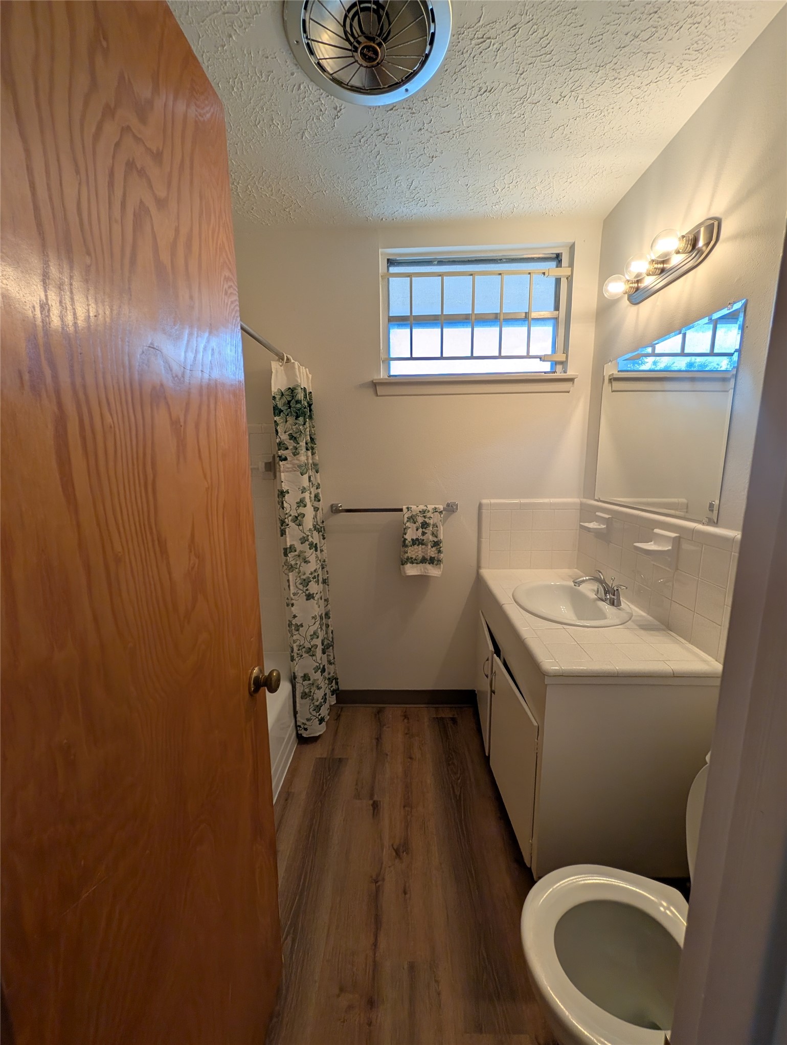 322 Ravenhead Drive Houston, TX 77034 - Photo 13 of 16 a bathroom with a sink a toilet and shower