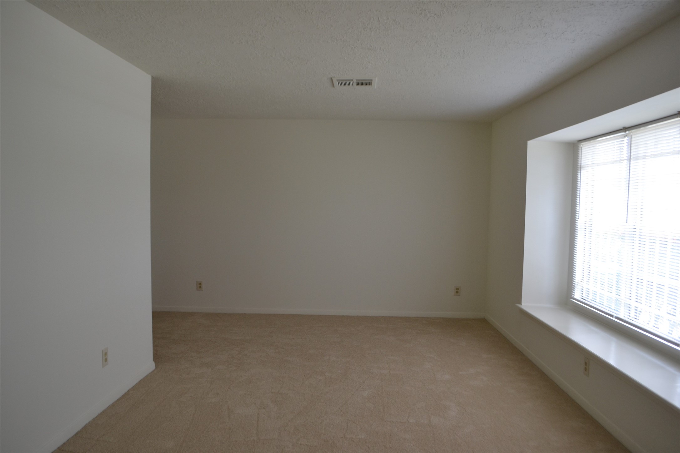 322 Ravenhead Drive Houston, TX 77034 - Photo 3 of 16 an empty room with a window