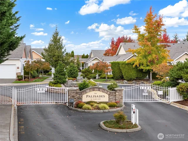 an aerial view of a house with a swimming pool yard and outdoor seating
