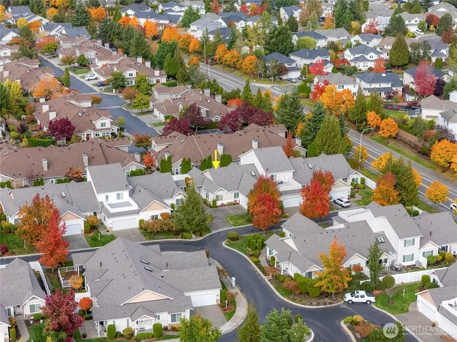 an aerial view of residential building and ocean