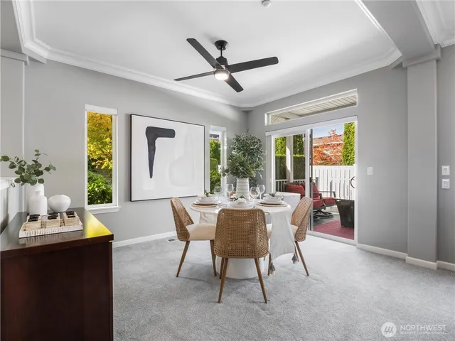 a dining room with furniture and window
