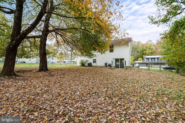 a pathway of a house with a yard