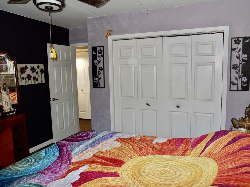 108 Kenneth Circle Elgin, IL 60120 - Photo 16 of 28 a bedroom with a bed and a flat tv screen