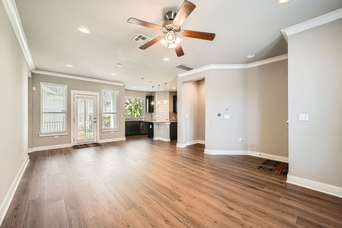 14709 Stillman Bend, Unit 52 Austin, TX 78717 - Photo 11 of 28 a view of an empty room with window and wooden floor