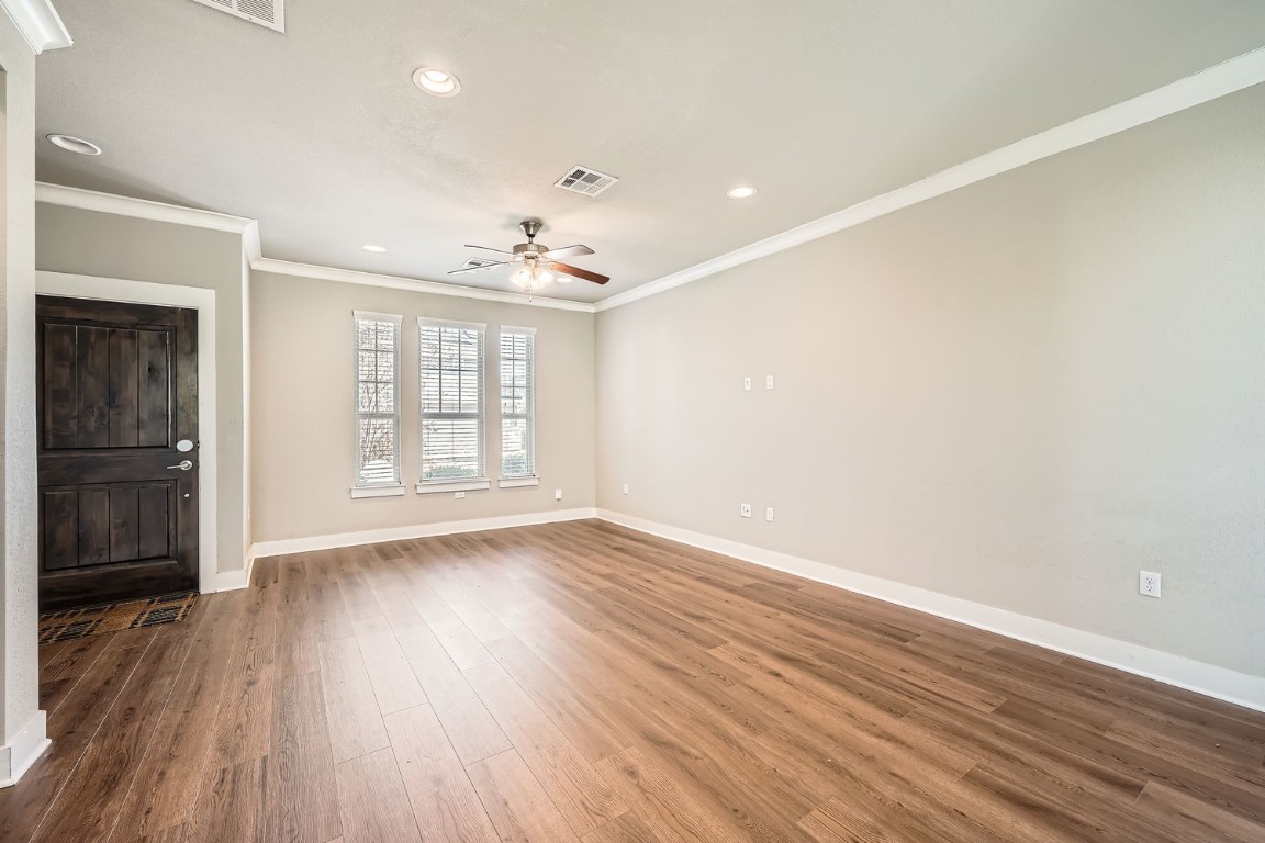 14709 Stillman Bend, Unit 52 Austin, TX 78717 - Photo 12 of 28 wooden floor in an empty room with a window
