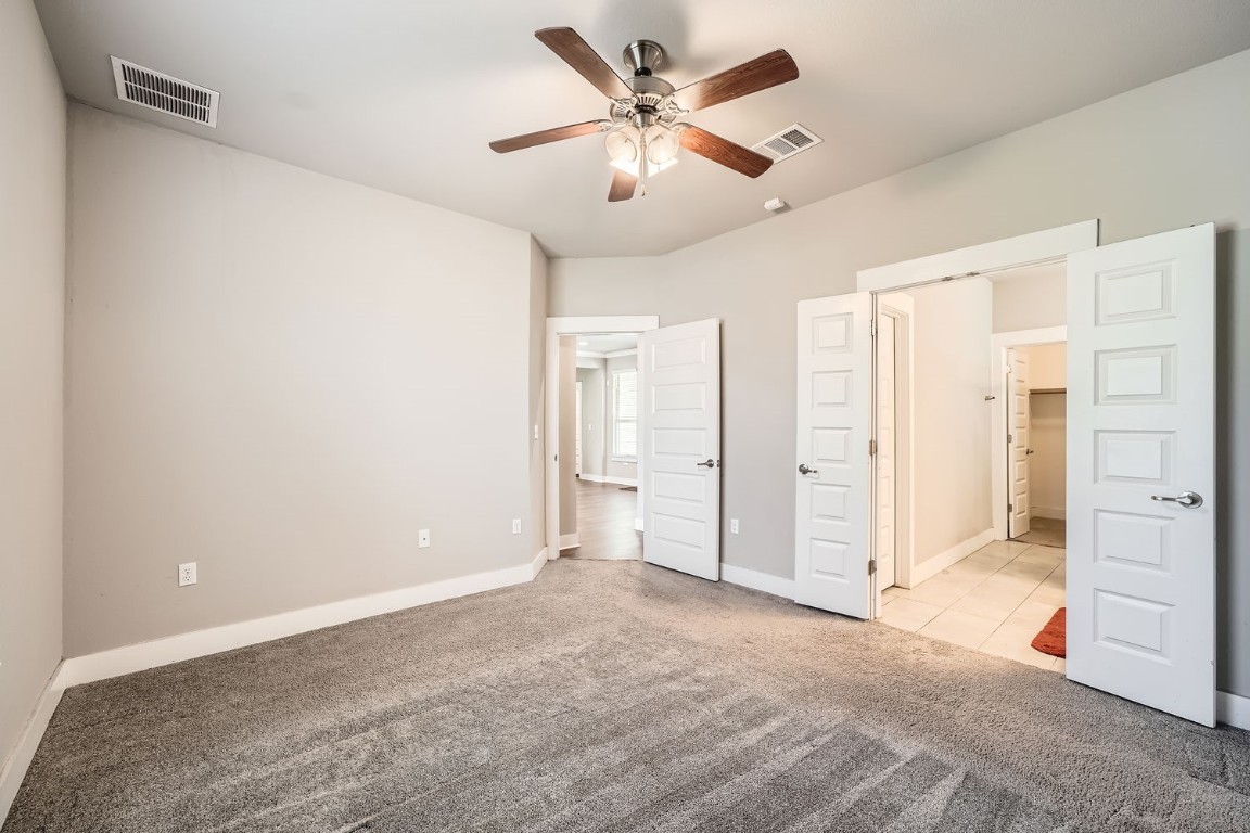 14709 Stillman Bend, Unit 52 Austin, TX 78717 - Photo 13 of 28 a view of a livingroom with a ceiling fan and entryway