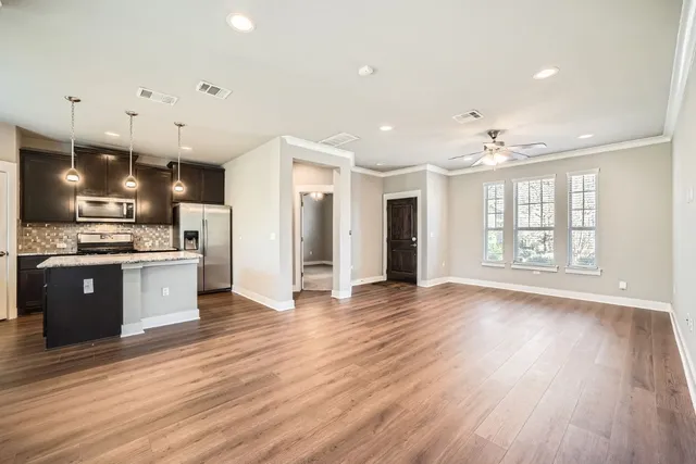a view of kitchen with stainless steel appliances refrigerator oven and stove