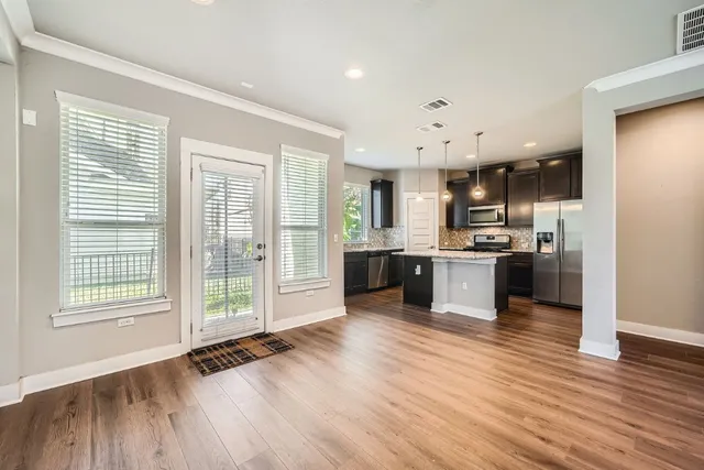 a view of kitchen with wooden floor