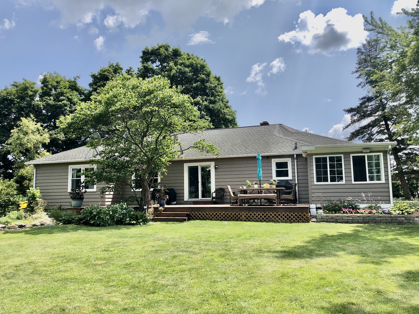 12907 Barber Greene Road Sycamore, IL 60178 - Photo 5 of 42 a front view of house with yard and outdoor seating