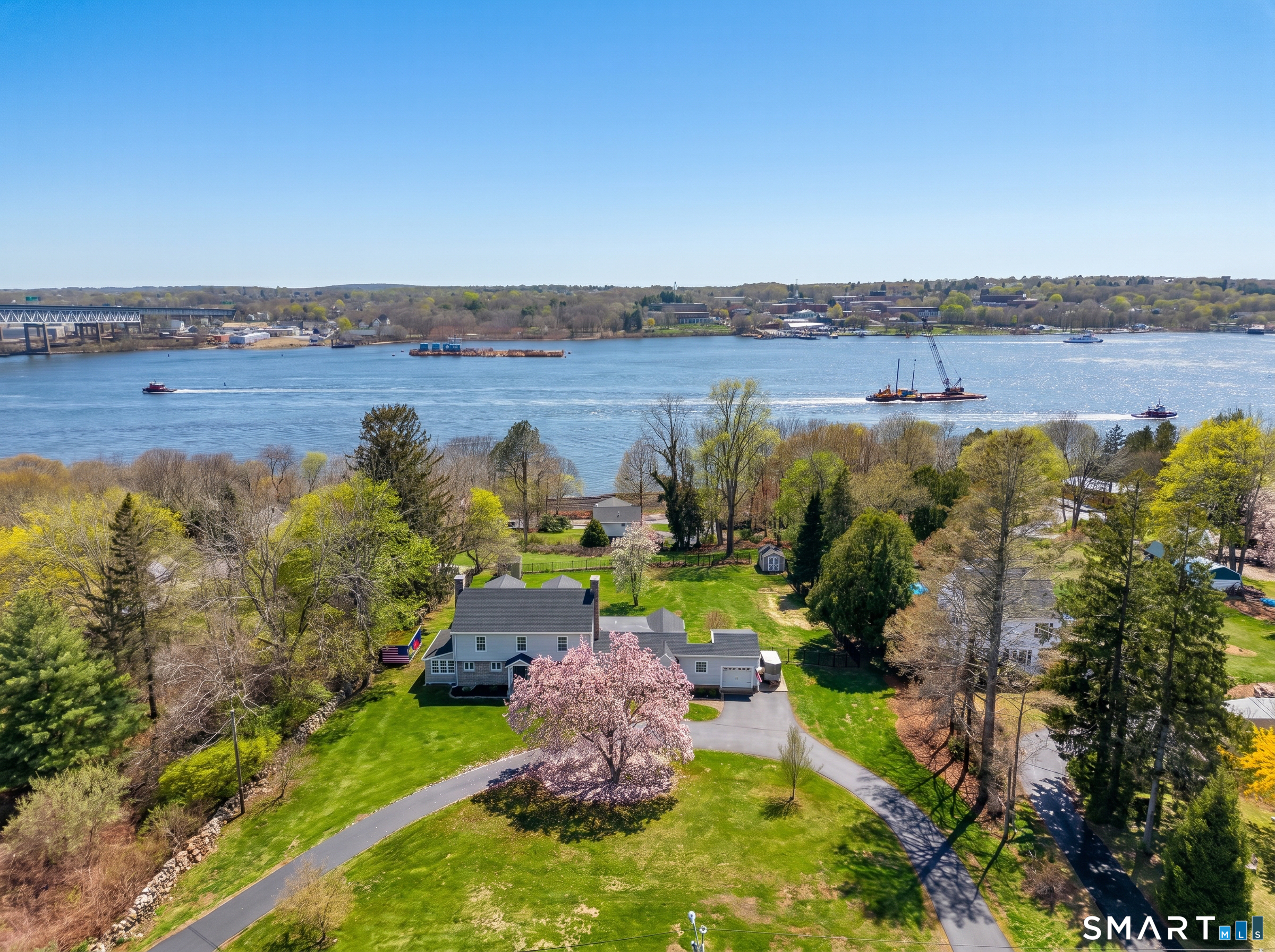 76 Starr Hill Road Groton, CT 06340 - Photo 2 of 40 an aerial view of a house with a garden and lake view