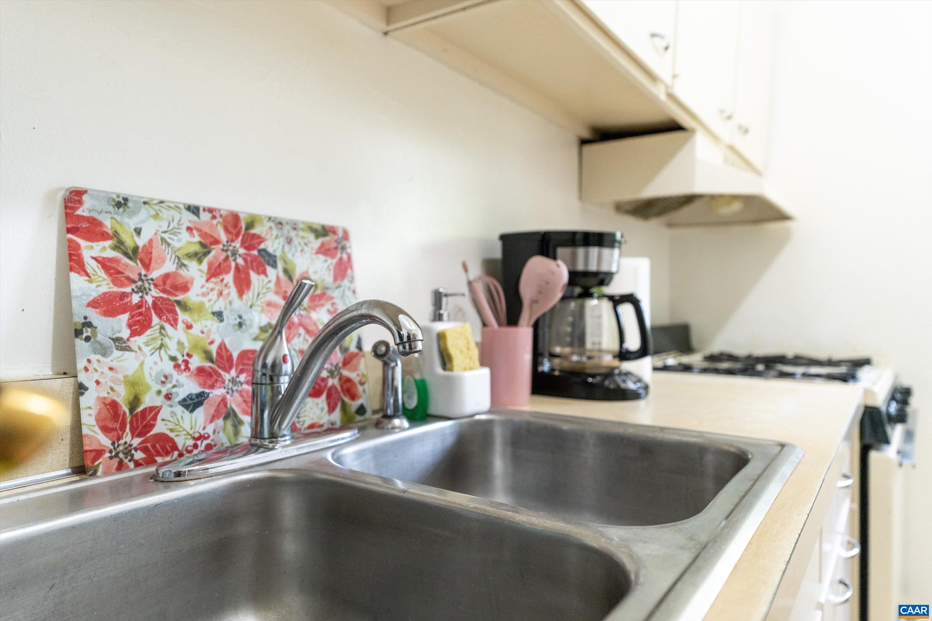 2517 Hydraulic Road, Unit 73 Charlottesville, VA 22901 - Photo 13 of 22 a kitchen with a stove and a sink