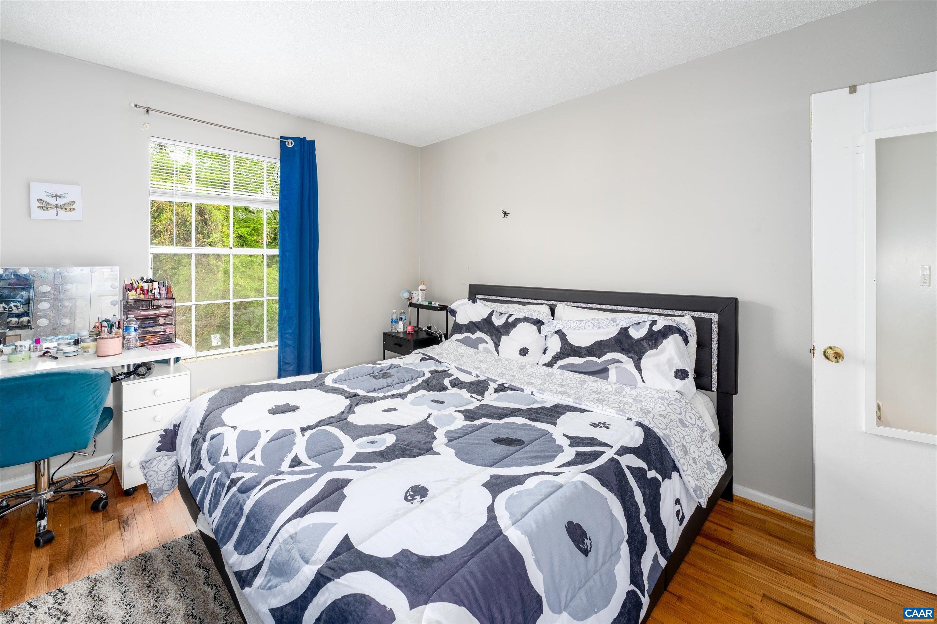 2517 Hydraulic Road, Unit 73 Charlottesville, VA 22901 - Photo 15 of 22 a bed sitting in a bedroom next to a window