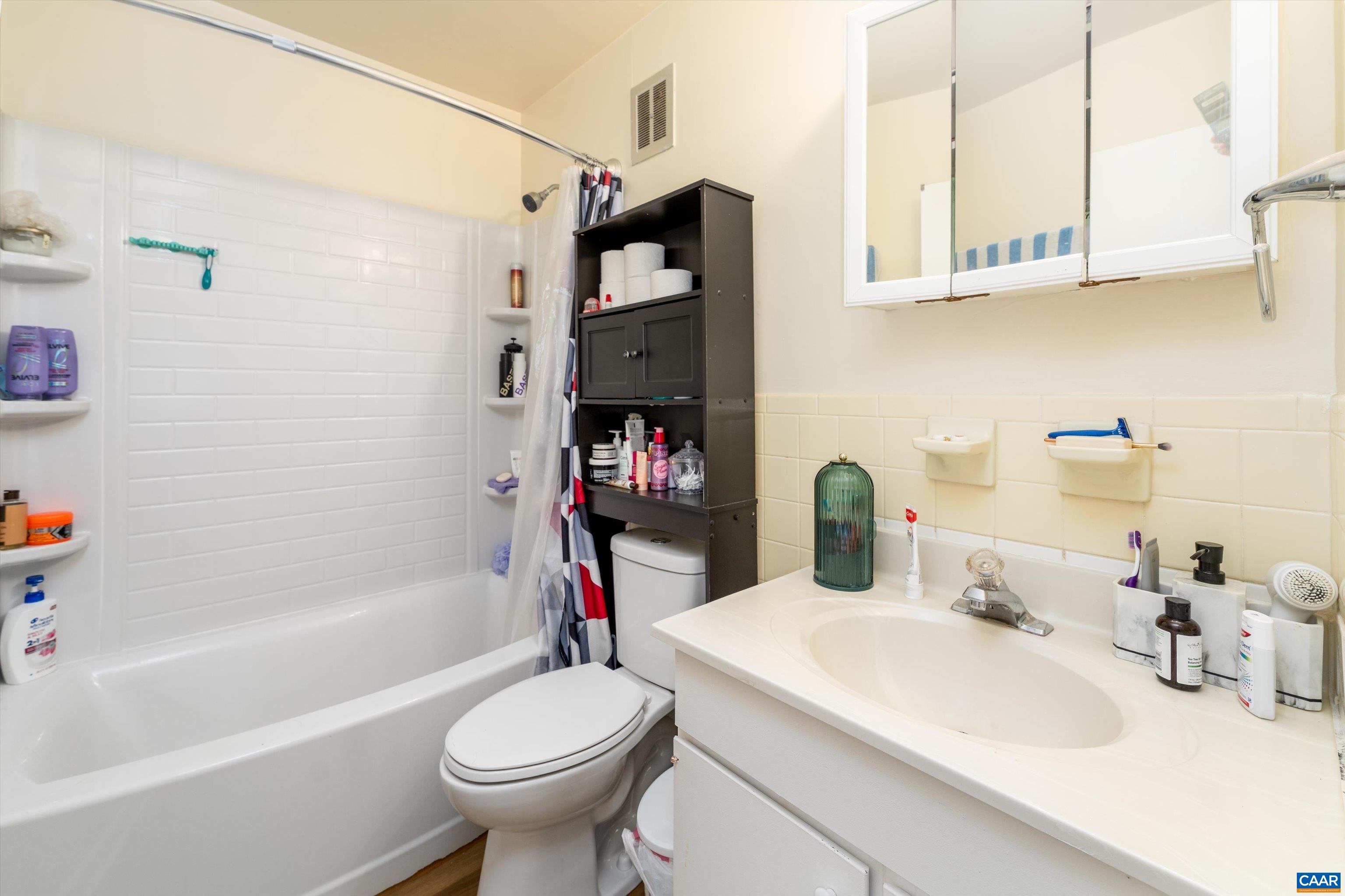 2517 Hydraulic Road, Unit 73 Charlottesville, VA 22901 - Photo 17 of 22 a bathroom with a sink toilet and a bathtub