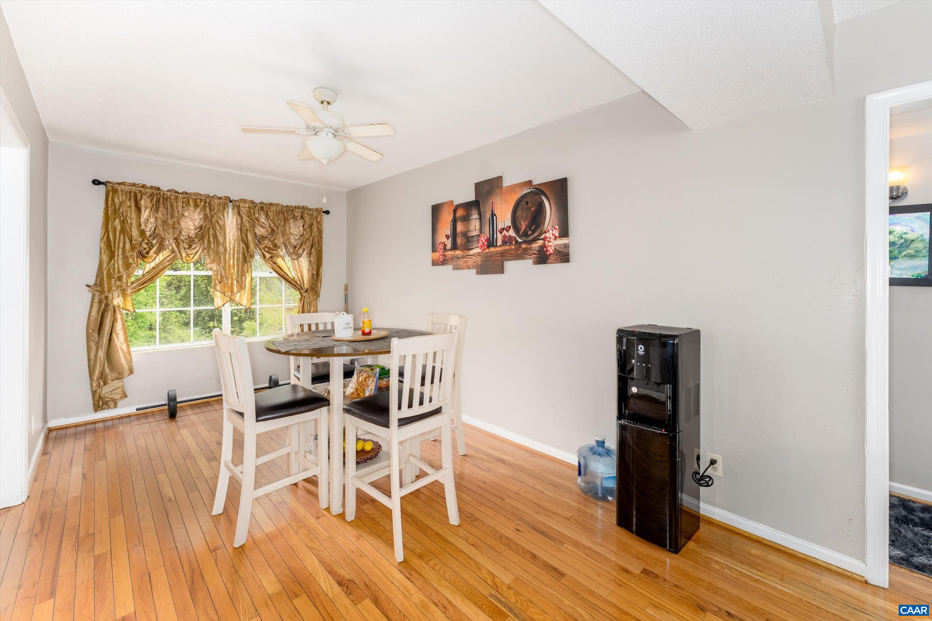 2517 Hydraulic Road, Unit 73 Charlottesville, VA 22901 - Photo 7 of 22 a view of a dining room with furniture window and wooden floor