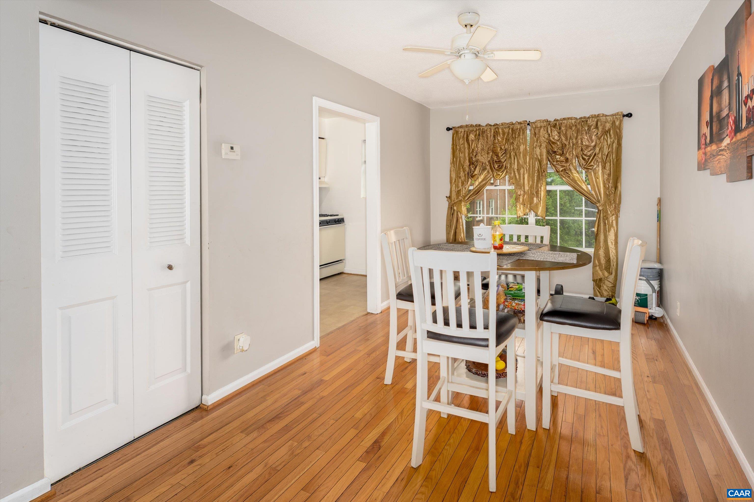 2517 Hydraulic Road, Unit 73 Charlottesville, VA 22901 - Photo 8 of 22 a view of a dining room with furniture window and wooden floor