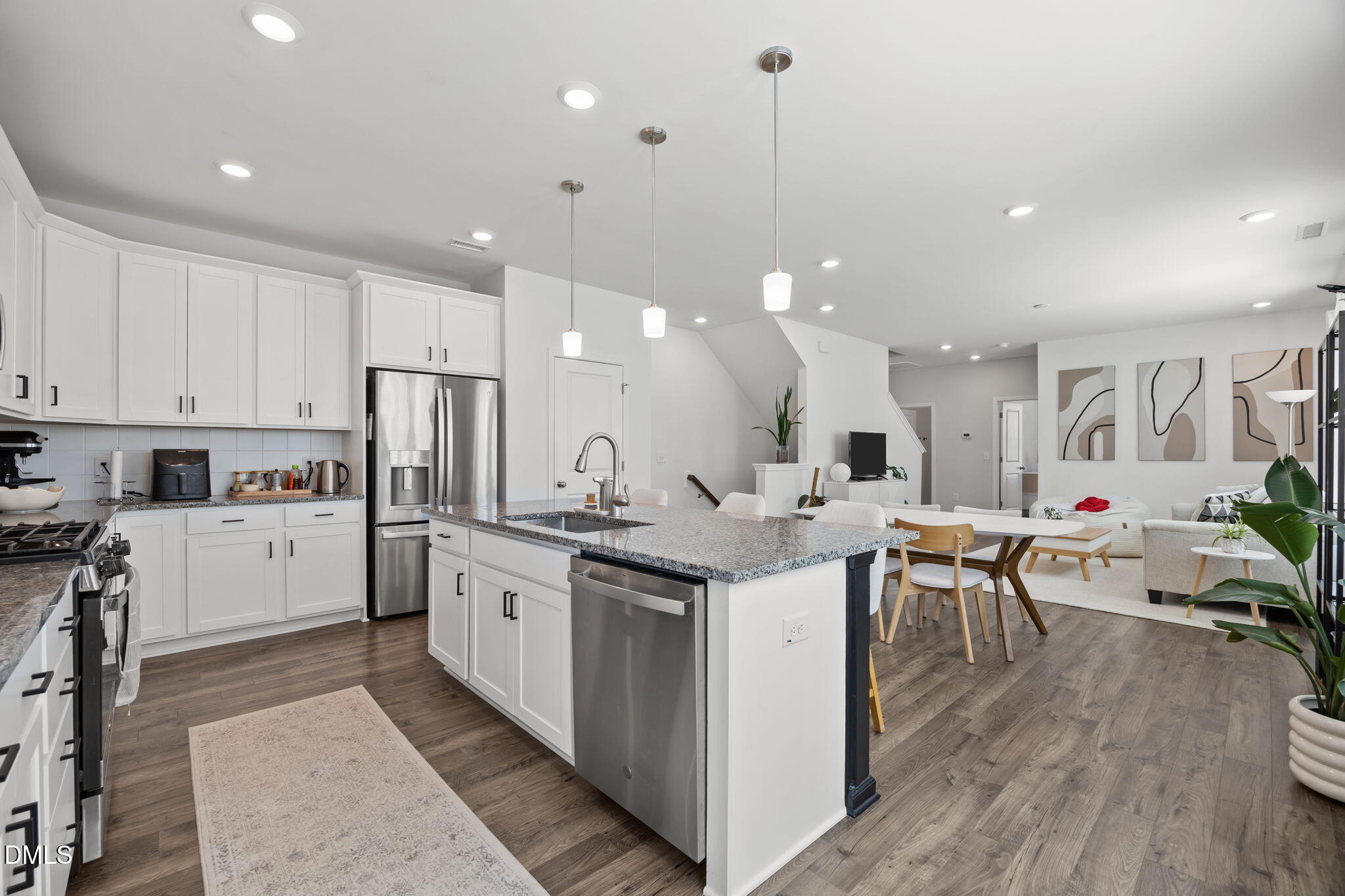 3013 Worthy Way Durham, NC 27703 - Photo 12 of 38 a kitchen with stainless steel appliances kitchen island a large island in the center