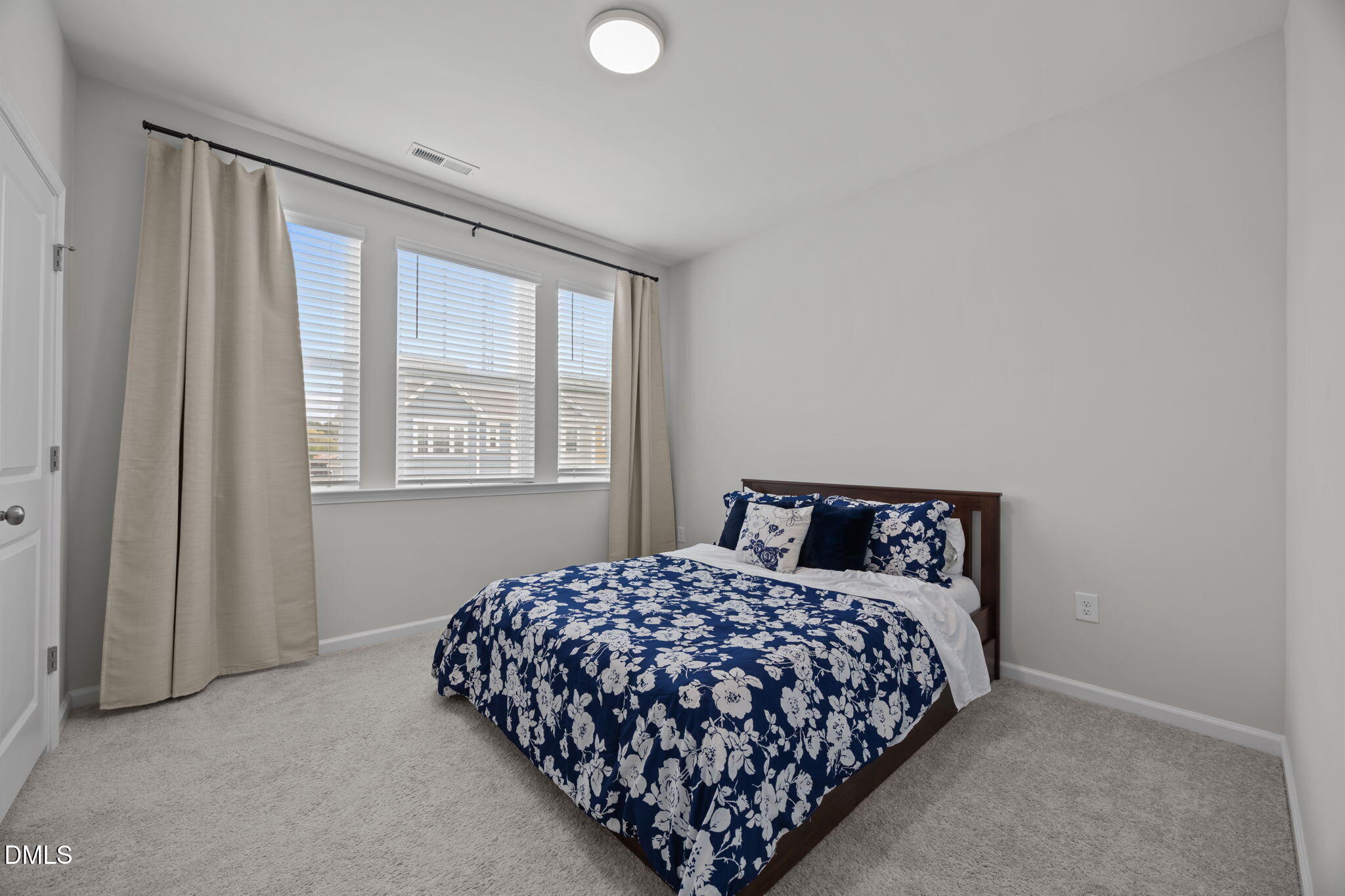 3013 Worthy Way Durham, NC 27703 - Photo 23 of 38 a bedroom with a bed and a window