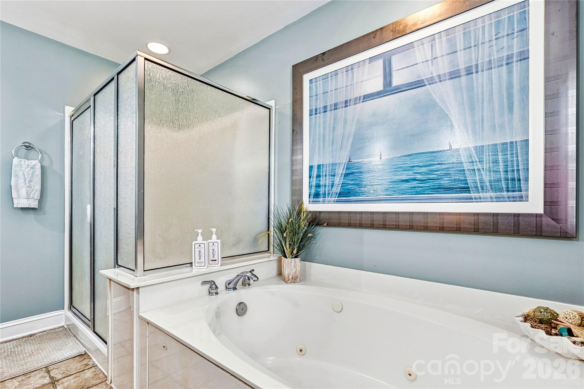 1606 High Ridge Drive Stanley, NC 28164 - Photo 22 of 44 a bathroom with a tub and a shower