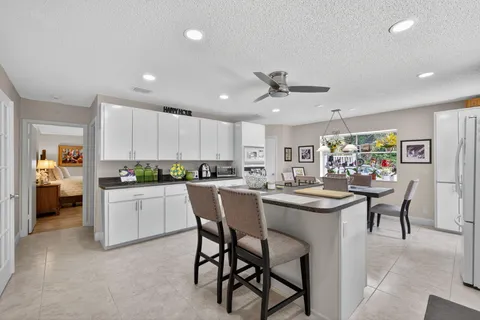 a view of walk in closet with clothes