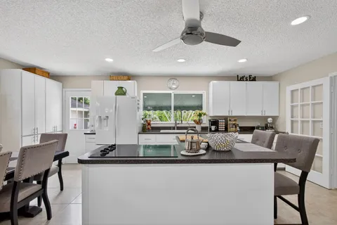 a bedroom with furniture and a chandelier